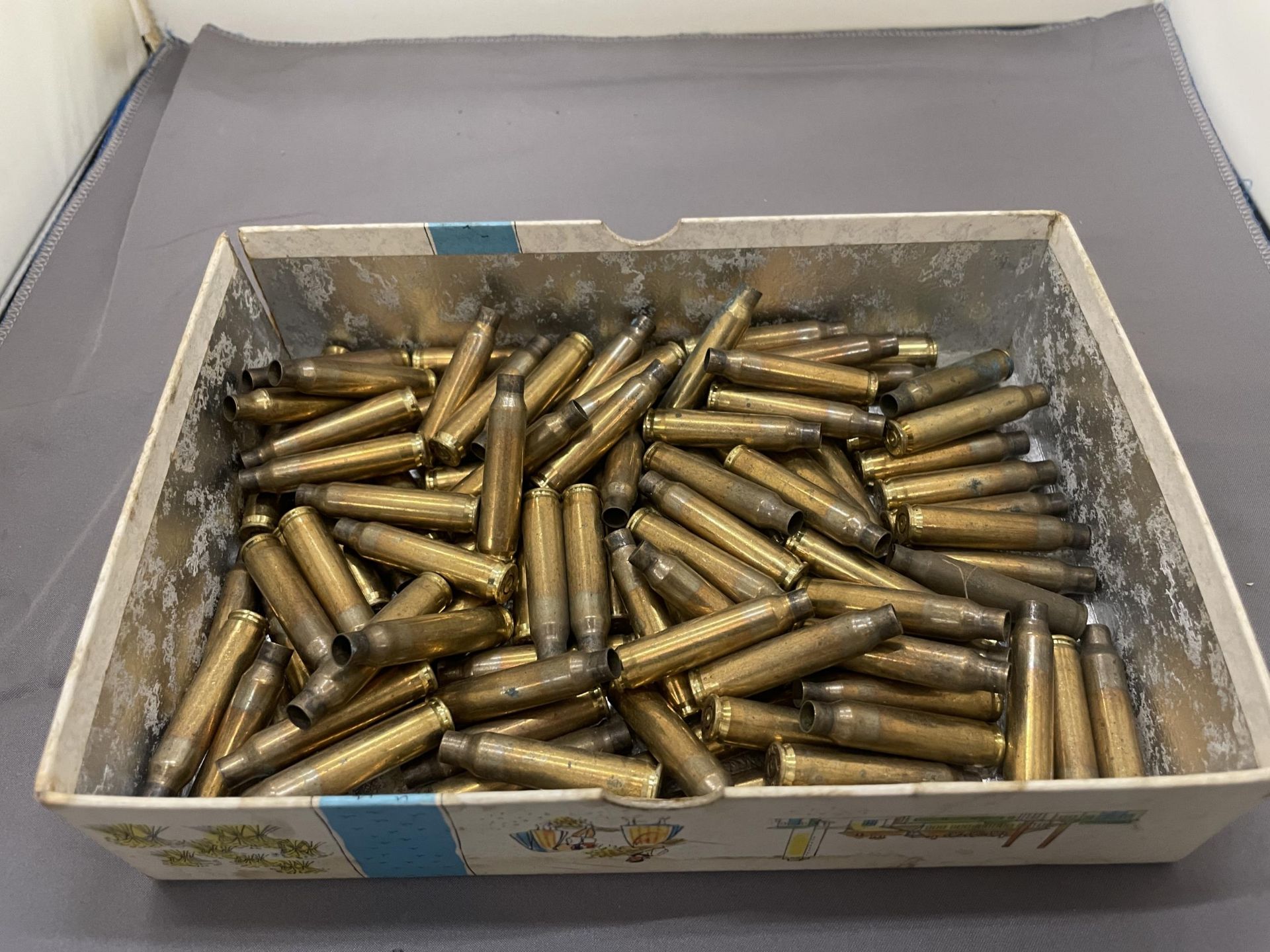 A QUANTITY OF OVER 100 BRASS BULLET CASINGS