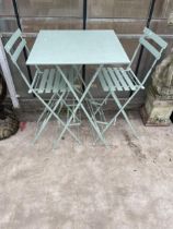 A TALL METAL FOLDING PATIO TABLE AND TWO FOLDING STOOLS