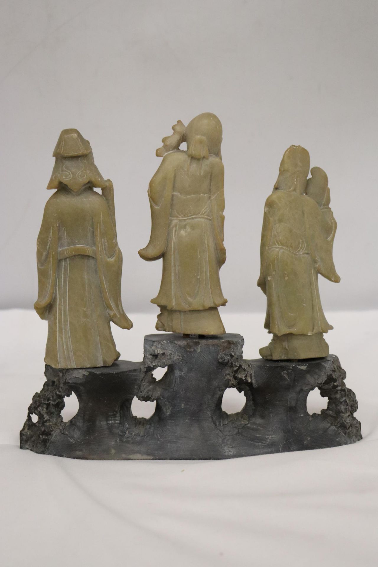 AN ORIENTAL CARVING OF THREE ELDERS ON A PLINTH, HEIGHT 21CM, WIDTH 22CM - Image 8 of 8