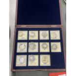 A COLLECTION OF RUSSIAN COINS IN CASES, HOUSED IN A DISPLAY CASE - 11 IN TOTAL