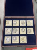 A COLLECTION OF RUSSIAN COINS IN CASES, HOUSED IN A DISPLAY CASE - 11 IN TOTAL