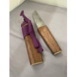 A VINTAGE JAPANESE TANTO WITH PURPLE SILK WRAP