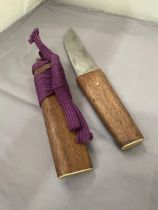 A VINTAGE JAPANESE TANTO WITH PURPLE SILK WRAP