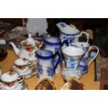 A COLLECTION OF VINTAGE BLUE AND WHITE JUGS PLUS A VASE - 5 IN TOTAL