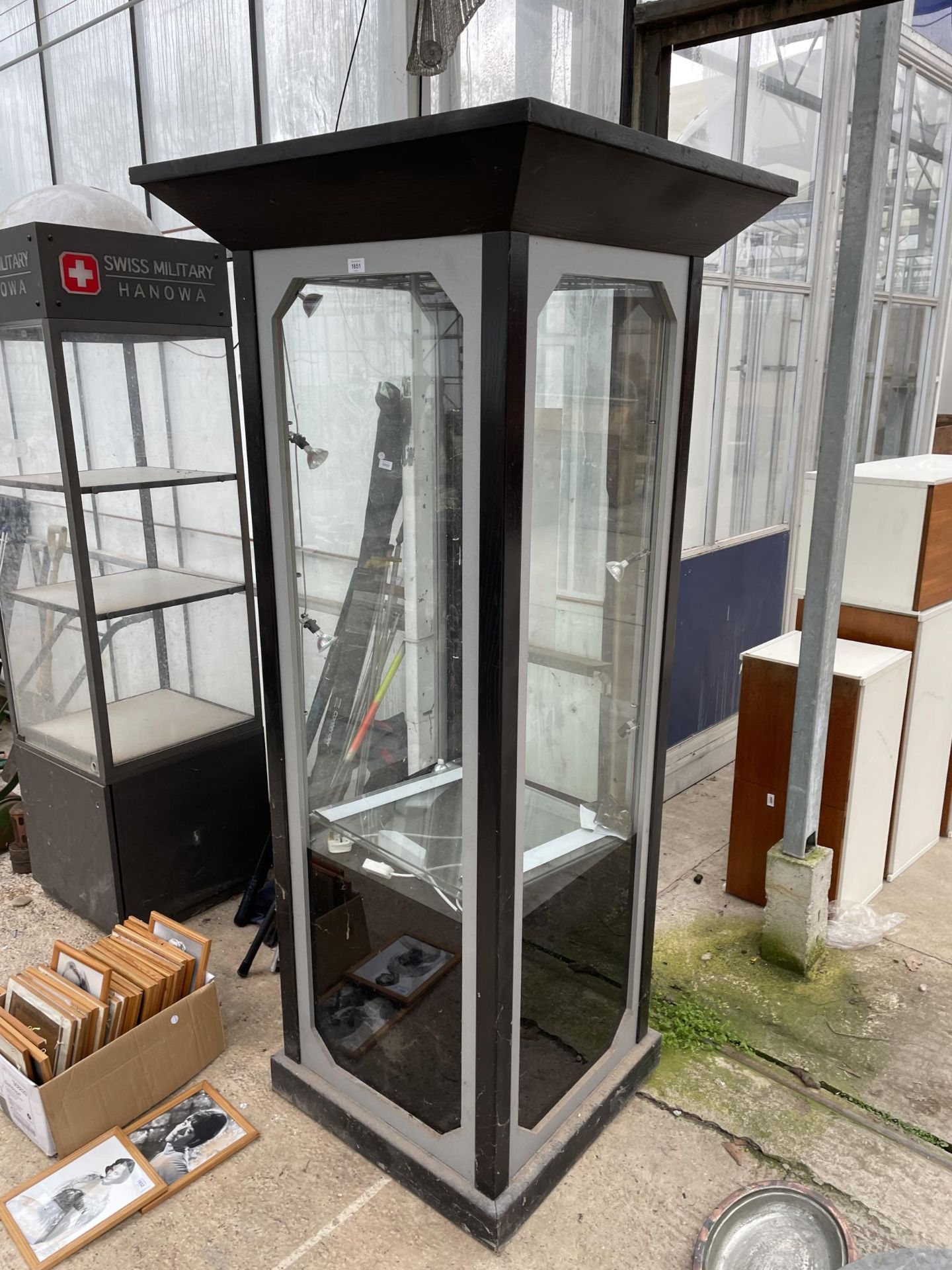 A LARGE WOODEN AND GLASS LIGHT UP DISPLAY CABINET