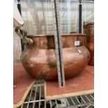 A LARGE VINTAGE COPPER BOWL PLANTER WITH TWIN HANDLES