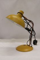 A YELLOW ANGLEPOISE LAMP