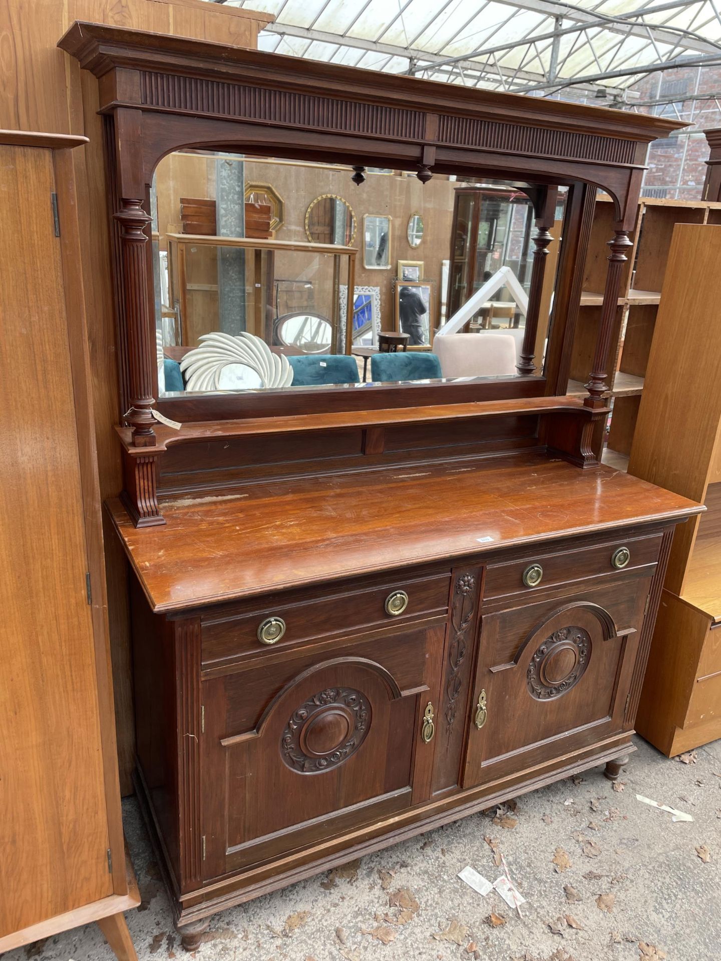 A LATE VICTORIAN MIRROR BACK SIDEBOARD WITH FLUTED COLUMNS AND CARVED PANEL DOORS TO BASE 62" WIDE