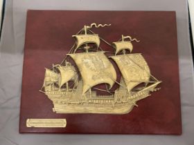 A VINTAGE EMBOSSED SPANISH GALLEON ON RED MOROCCO LEATHER, 30CM X 24CM