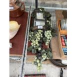 A VINTAGE AND DECORATIVE GRAPE VINE MIRROR