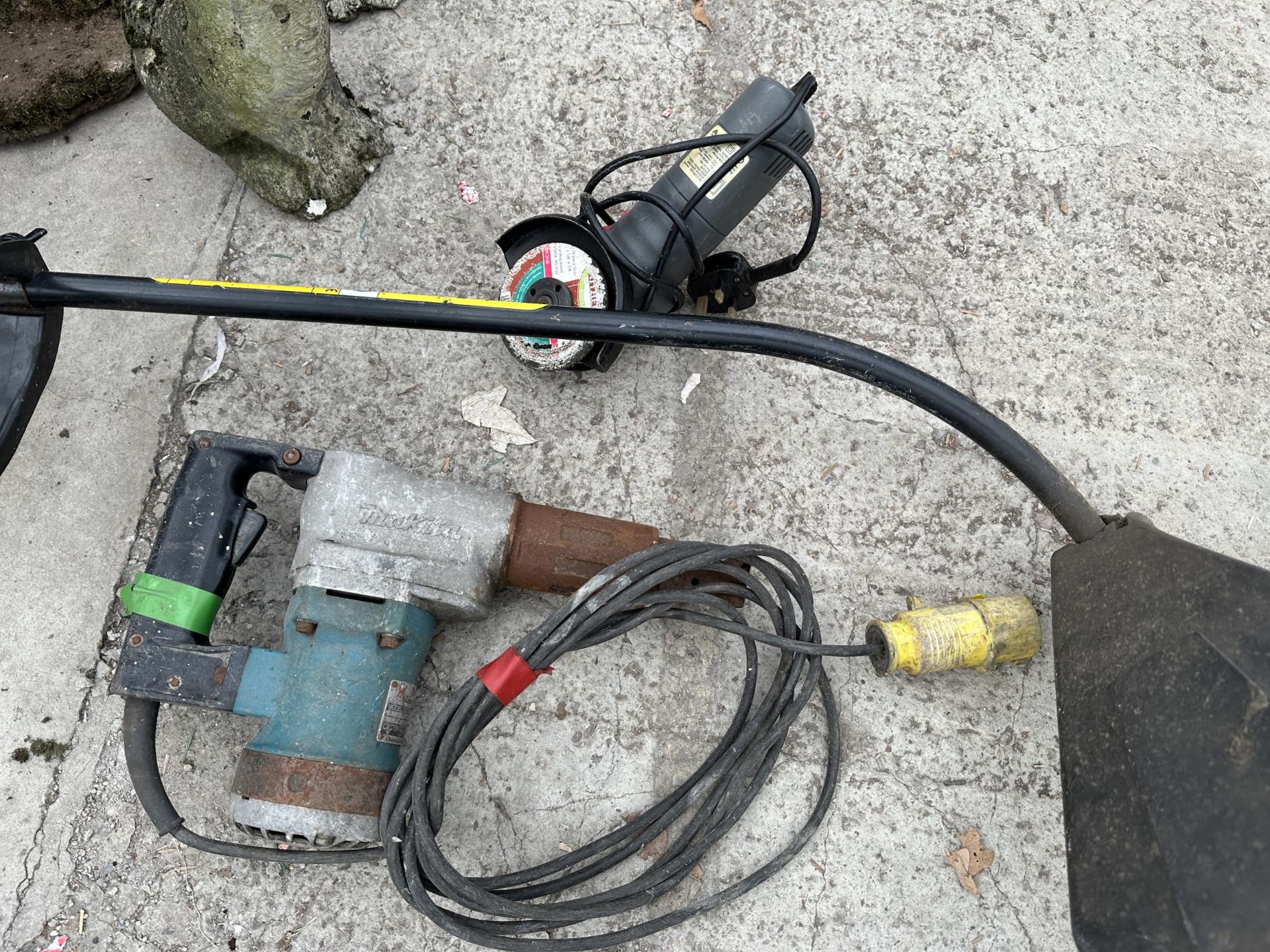 A MCCULLOCH PETROL GRASS STRIMMER, A MAKITA 110V DRILL AND AN ANGLE GRINDER - Image 2 of 3