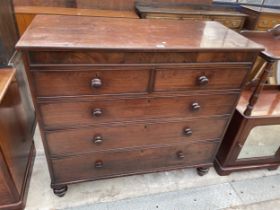 A 19TH CENTURY MAHOGANY CHEST OF TWO SHORT AND THREE LONG GRADUATED DRAWERS ON TURNED LEGS 48" WIDE