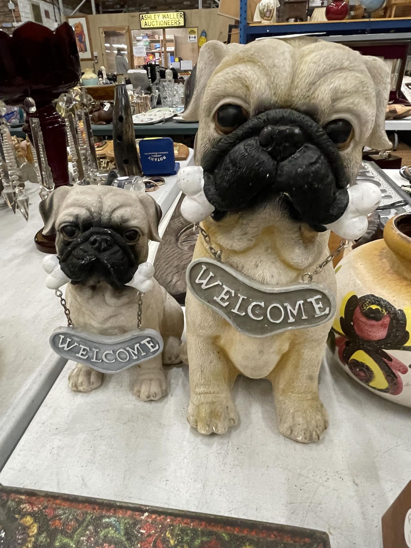 A MUMMY PUG AND PUPPY, 'WELCOME HOME' FIGURES, HEIGHTS 29CM AND 20CM