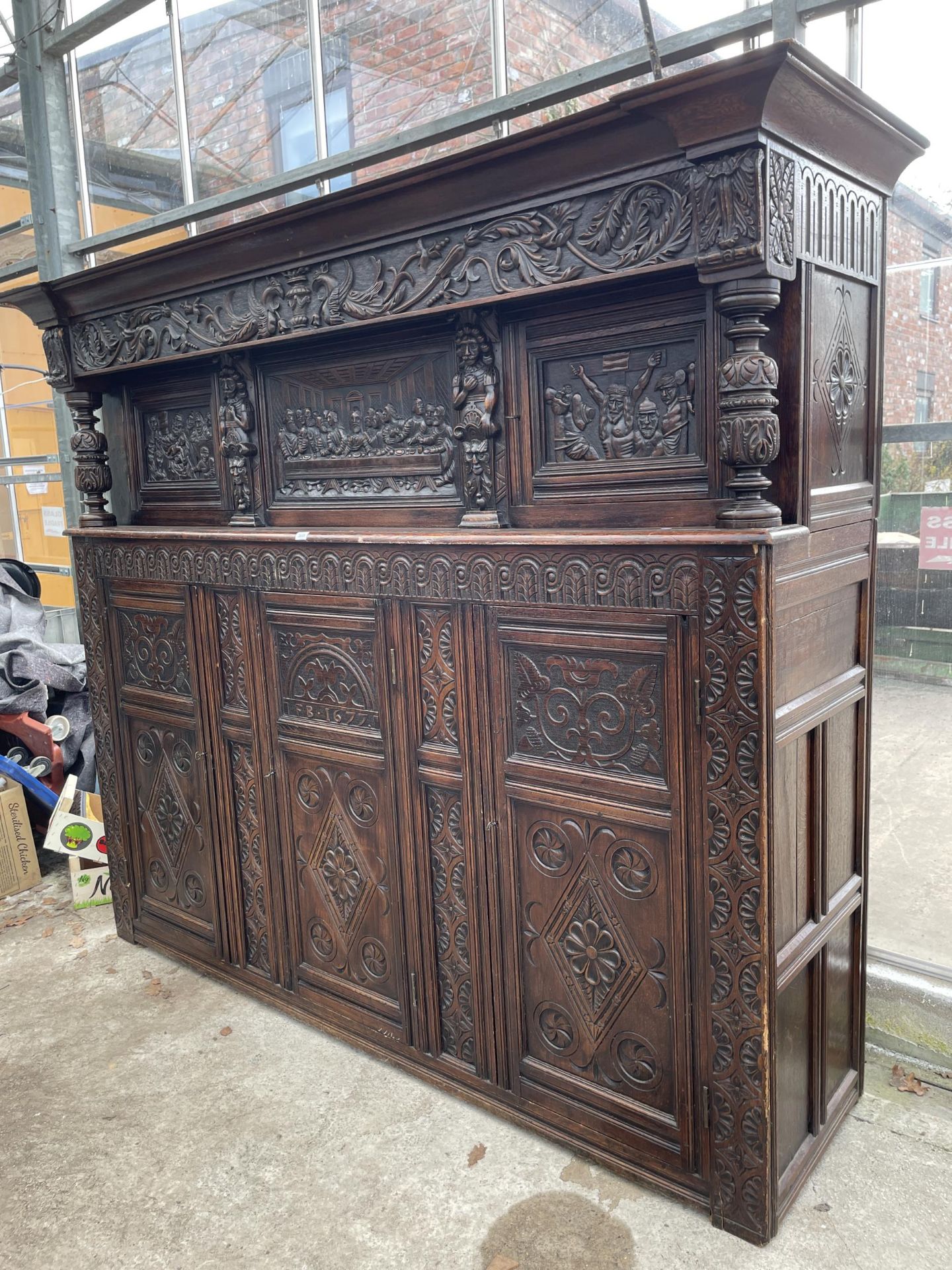 AN OAK GEORGE III STYLE COURT CUPBOARD WITH CARVED PANELS, THREE DEPICTING THE BIRTH AND CRUCIFIXION - Image 2 of 12