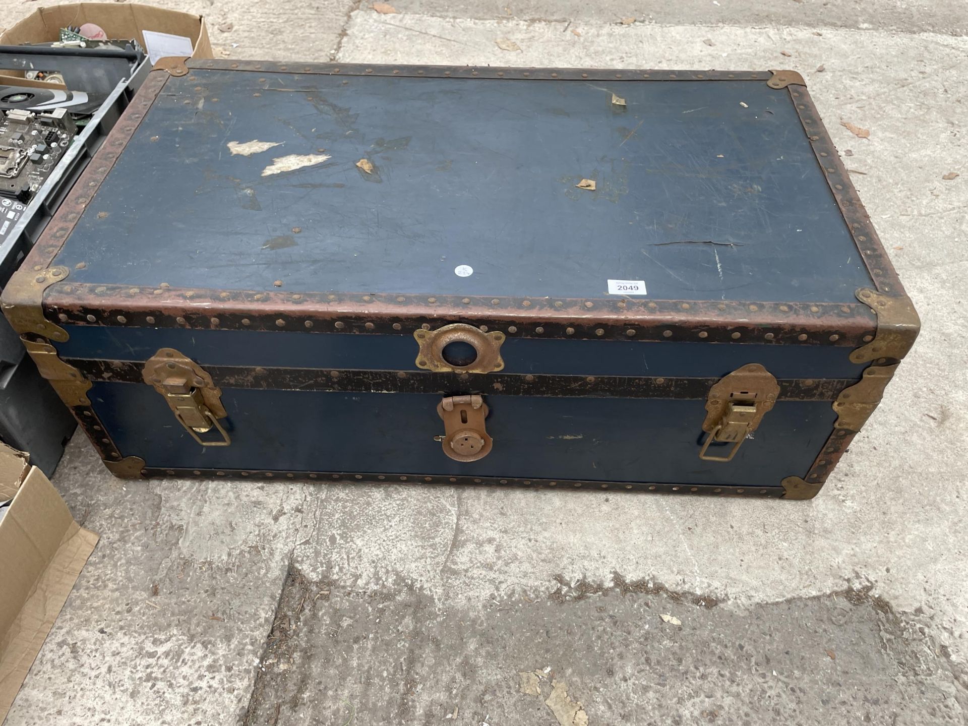 A VINTAGE TRAVEL TRUNK BEARING THE INITIALS C.A.L