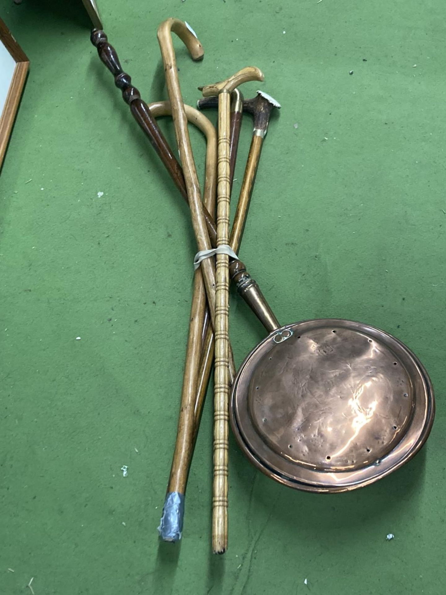 FIVE VINTAGE WALKING STICKS TO INCLUDE WITH A BRASS DUCK HEAD HANDLE AND A COPPER WARMING PAN