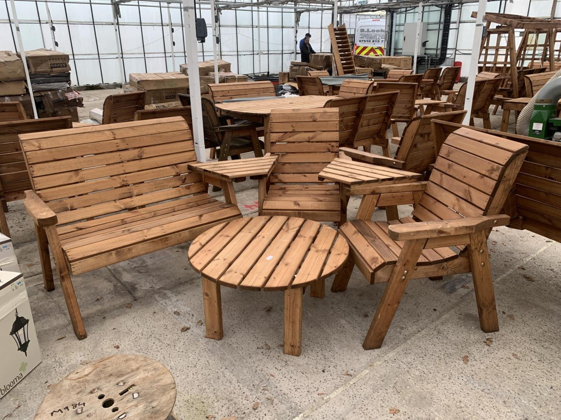 AN AS NEW EX DISPLAY CHARLES TAYLOR GARDEN FURNITURE SET TO INCLUDE A TWO SEATER BENCH, TWO CHAIRS
