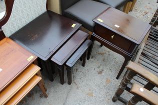 A STAG MINSTREL NEST OF THREE TABLES AND A BEDSIDE TABLE