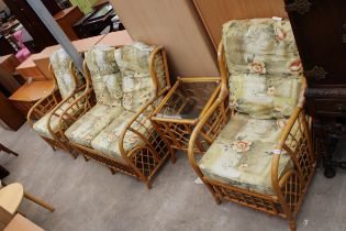 A BAMBOO AND WICKER SUITE COMPRISING OF A TWO SEATER SETTEE, TWO CHAIRS AND A TABLE