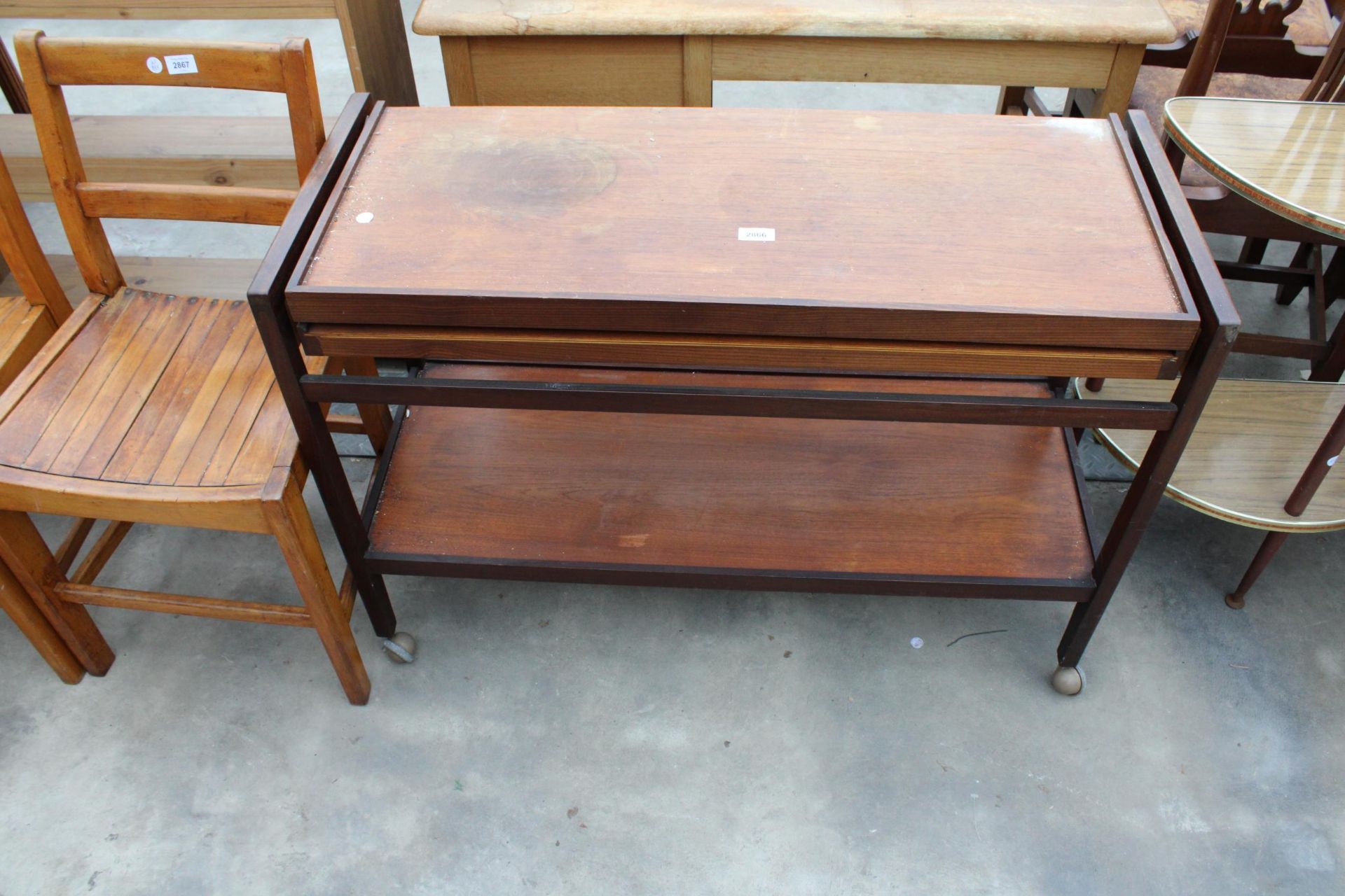 A RETRO TEAK FOLD OVER TROLLEY TABLE 39" WIDE