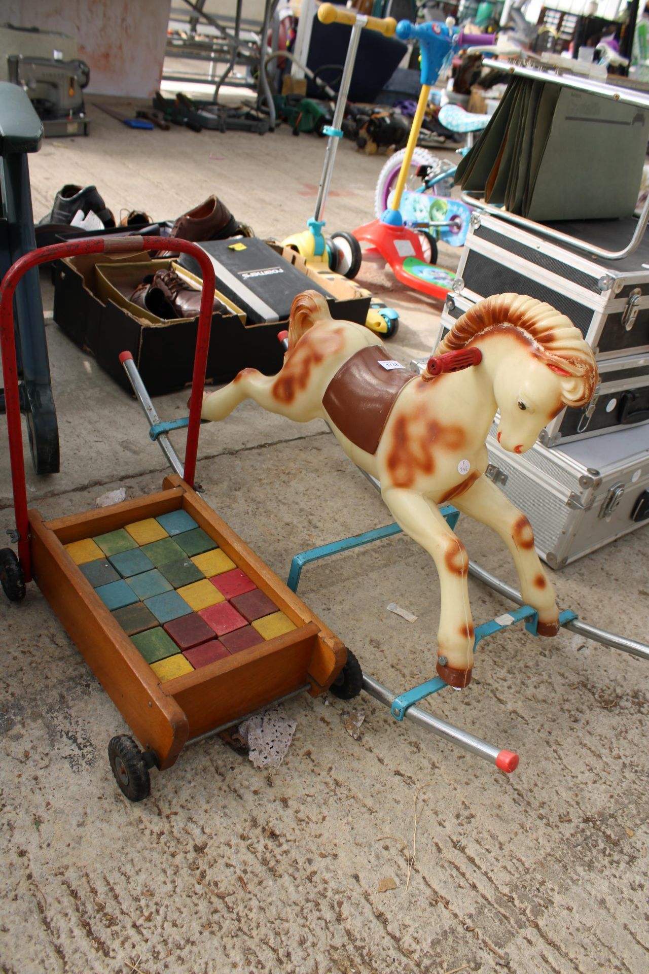 A SMALL CHILDS ROCKING HORSE AND A PUSH ALONG TROLLEY WITH WOODEN BLOCKS - Image 2 of 2