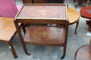 A MAHOGANY AND INLAID TWO TIER TROLLEY ON CASTERS