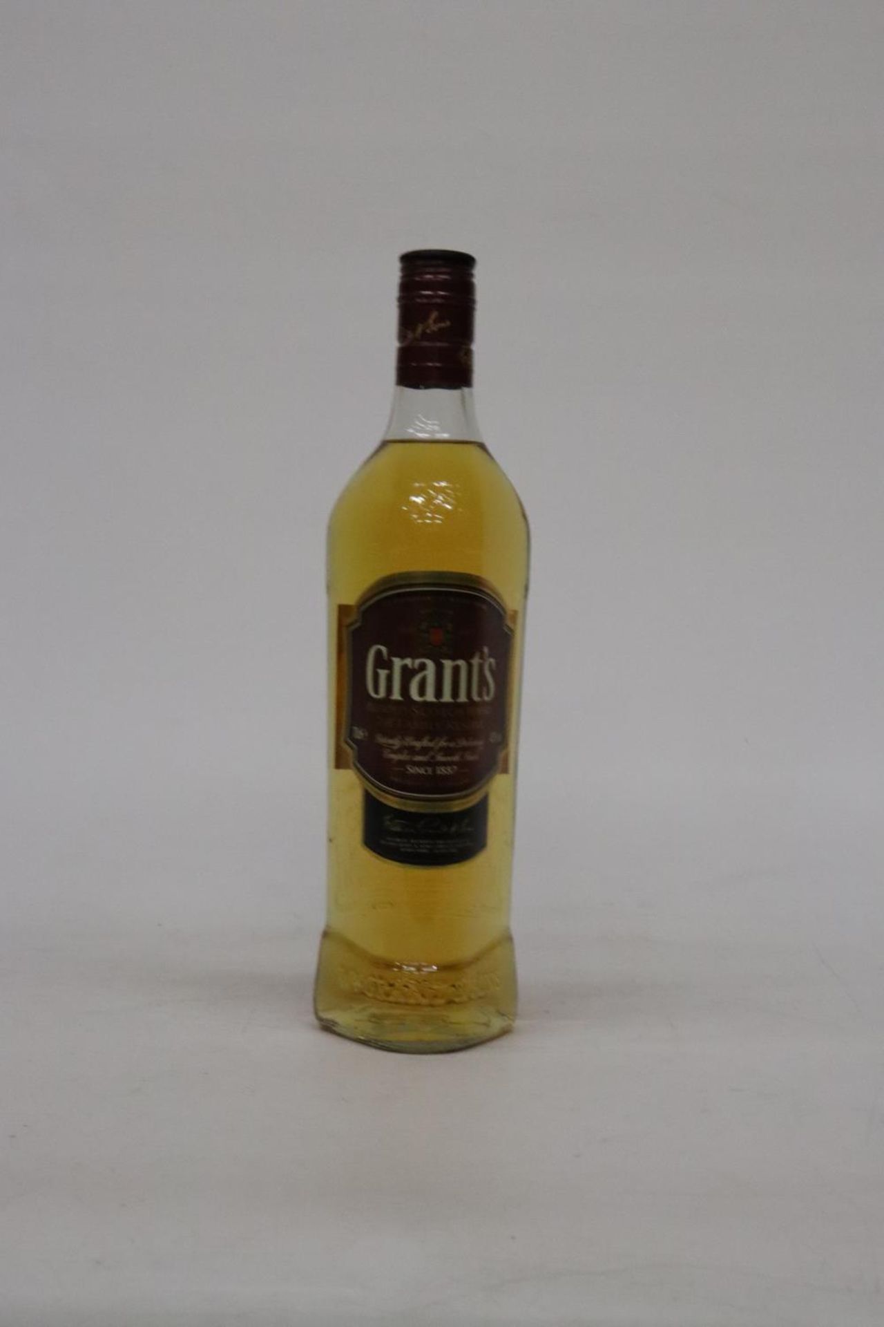 A 70CL BOTTLE OF GRANTS WHISKY