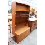 A RETRO TEAK UNIT WITH SMOKED GLASS DOORS, CUPBOARD AND DRAWERS TO BASE. 39.5" WIDE