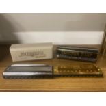 TWO HARMONICAS TO INCLUDE A SUZUKI BLUESMASTER IN KEY 'C' AND A FRONTIER HARP HARMONICA GOLD