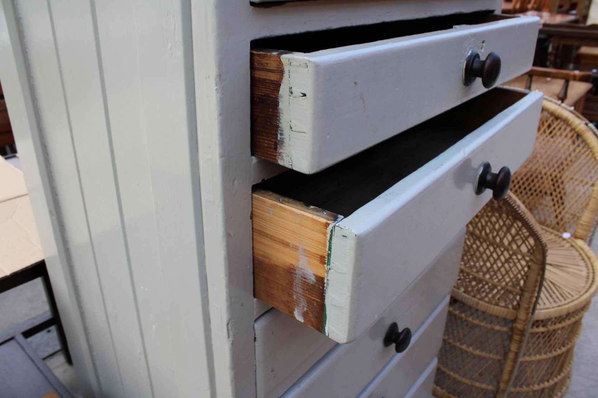 A PAINTED VICTORIAN PINE CHEST OF SEVEN GRADUATED WITH SLOPING TOP 27" WIDE - Image 2 of 3