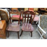 A MID TWENTIETH CENTURY OAK LADDER BACK CHAIR AND HARDWOOD KITCHEN CHAIR