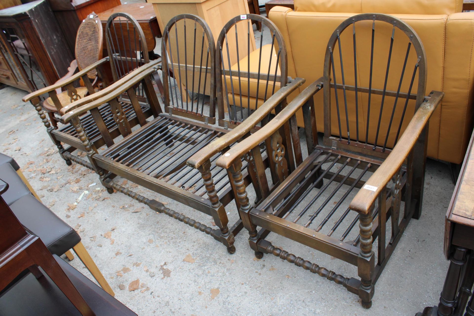 A MID 20TH CENTURY COTTAGE THREE PIECE SUITE WITH RECLINER BACKS, TURNED UPRIGHT AND WHEEL SIDE