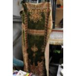 A VINTAGE OLIVE GREEN PATTERNED WALL HANGING, APPROX 60CM X 96CM