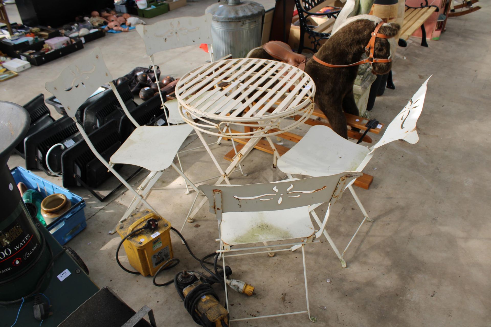 A METAL FOLDING BISTRO SET COMPRISING OF A ROUND TABLE AND FOUR CHAIRS