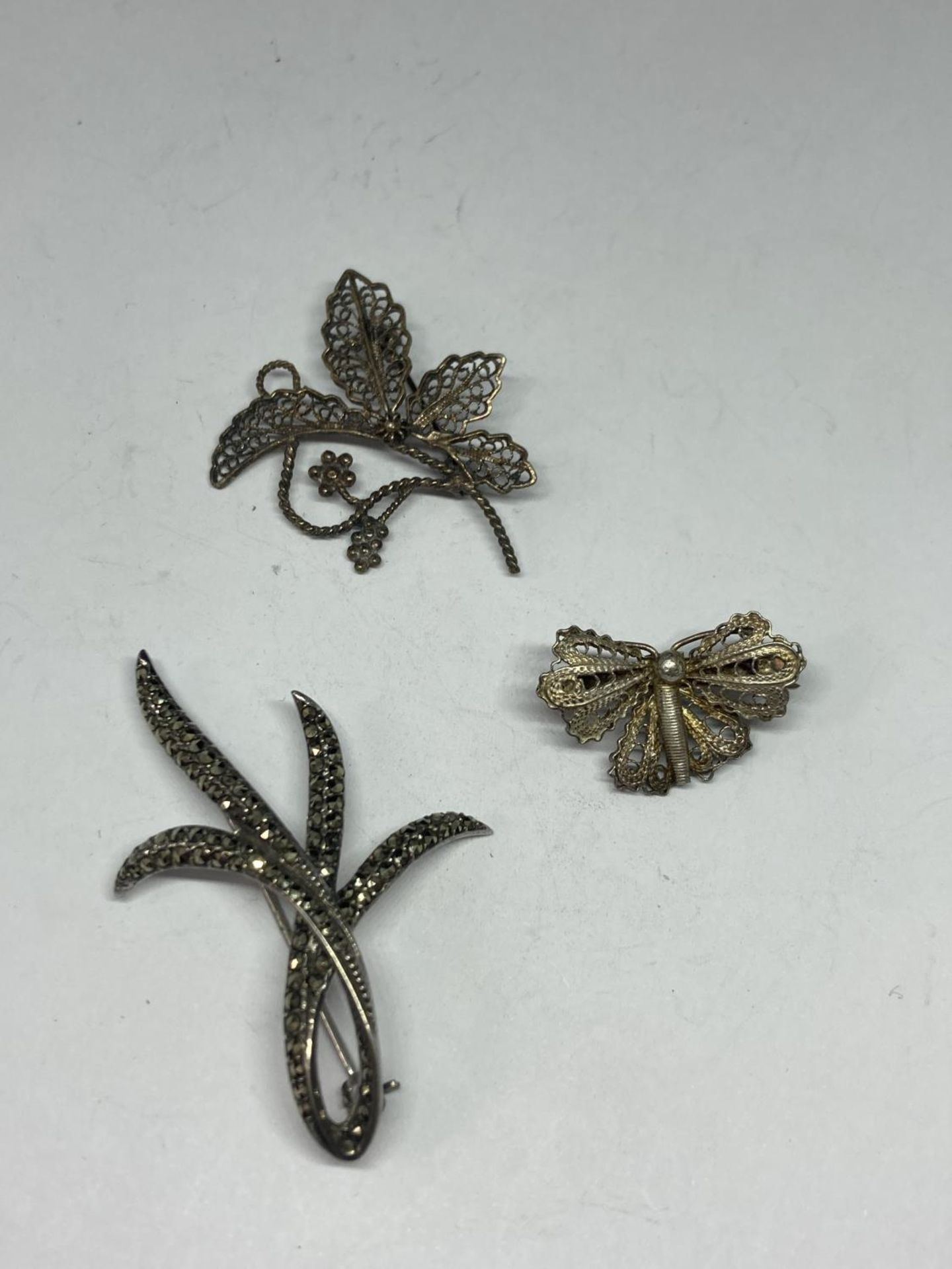 THREE SILVER BROOCHES