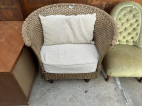 A RATTAN CONSERVATORY CHAIR WITH SWEPT BACK