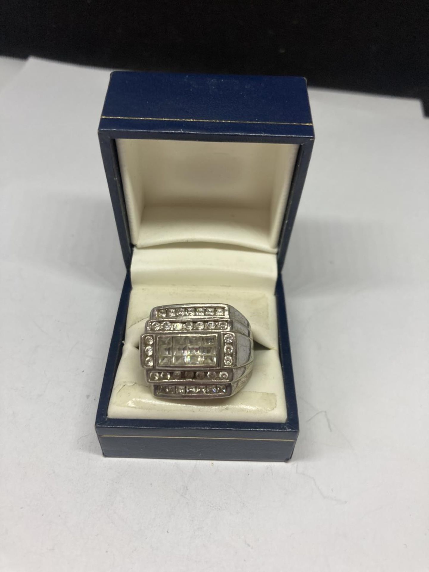 A LARGE SILVER GENTS RING