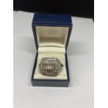 A LARGE SILVER GENTS RING