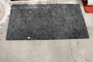 A MODERN GREY RUG