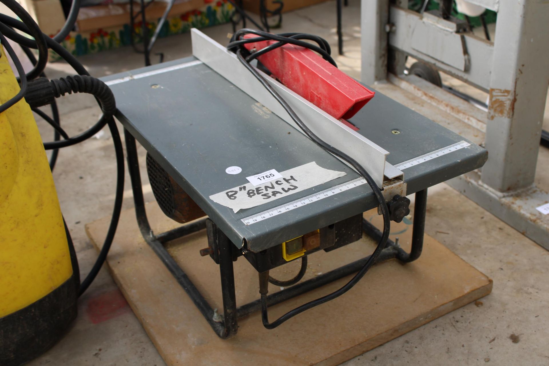 AN ELECTRIC 8" BENCH SAW