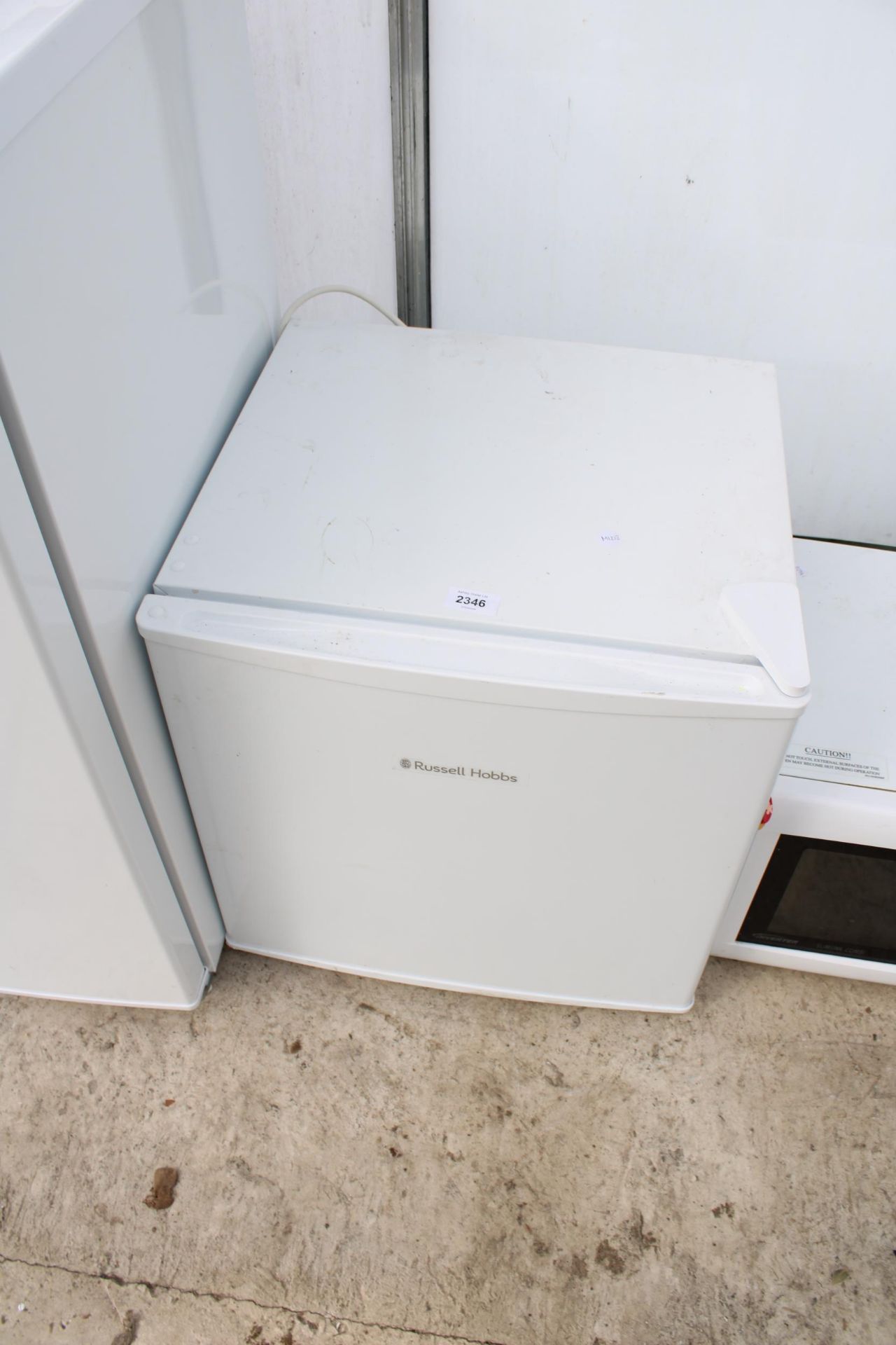 A WHITE RUSSELL HOBBS COUNTER TOP FRIDGE