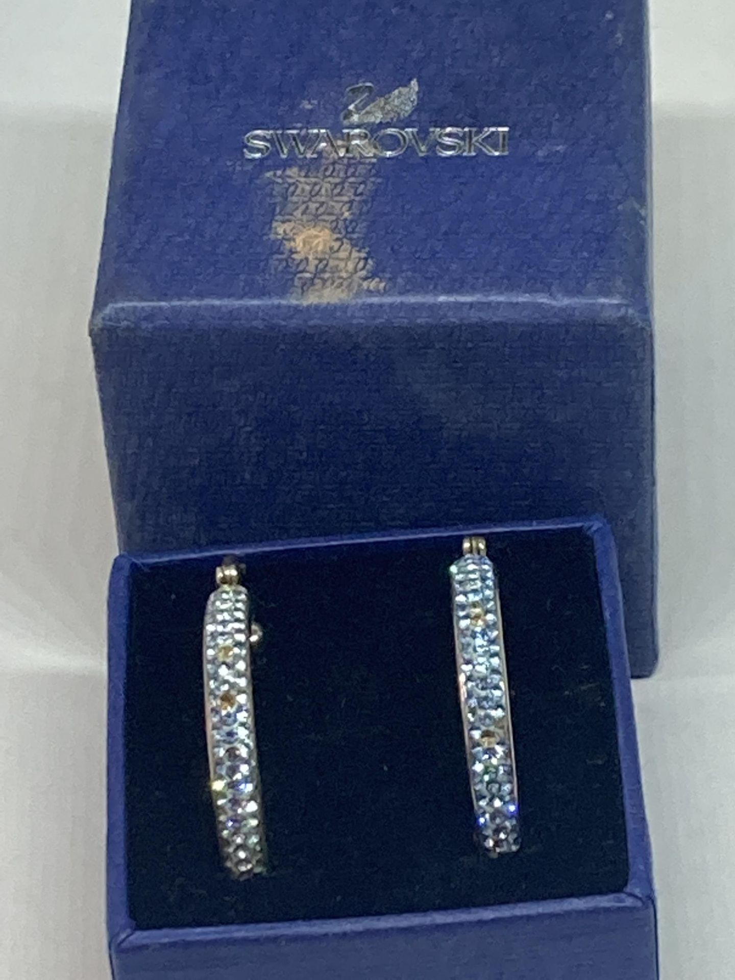 A PAIR OF SWAROVSKI CRYSTAL HOOP EARRINGS IN A PRESENTATION BOX