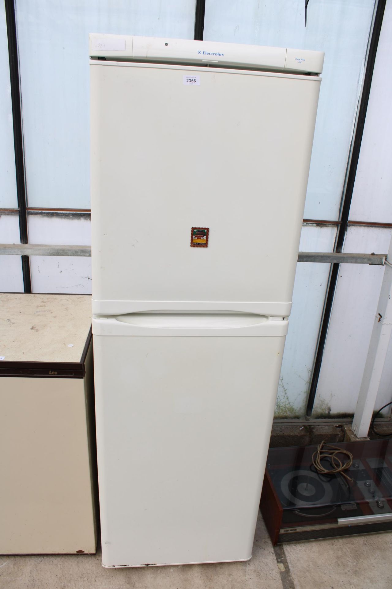 A TALL WHITE ELECTROLUX FRIDGE FREEZER