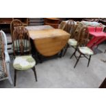 AN OVAL OAK GATELEG DINING TABLE AND FOUR ERCOL STYLE WINDSOR CHAIRS
