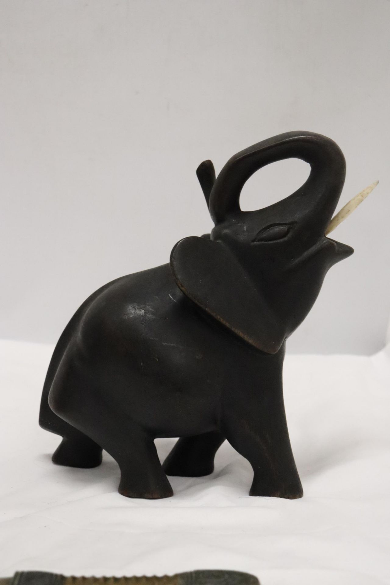 A HARDWOOD CARVED ELEPHANT, STONE ELEPHANT, MISSING A LEG AND A BRASS KNIFE - Image 12 of 12