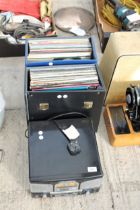 A PORTABLE RECORD PLAYER AND AN ASSORTMENT OF LP RECORDS