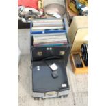 A PORTABLE RECORD PLAYER AND AN ASSORTMENT OF LP RECORDS