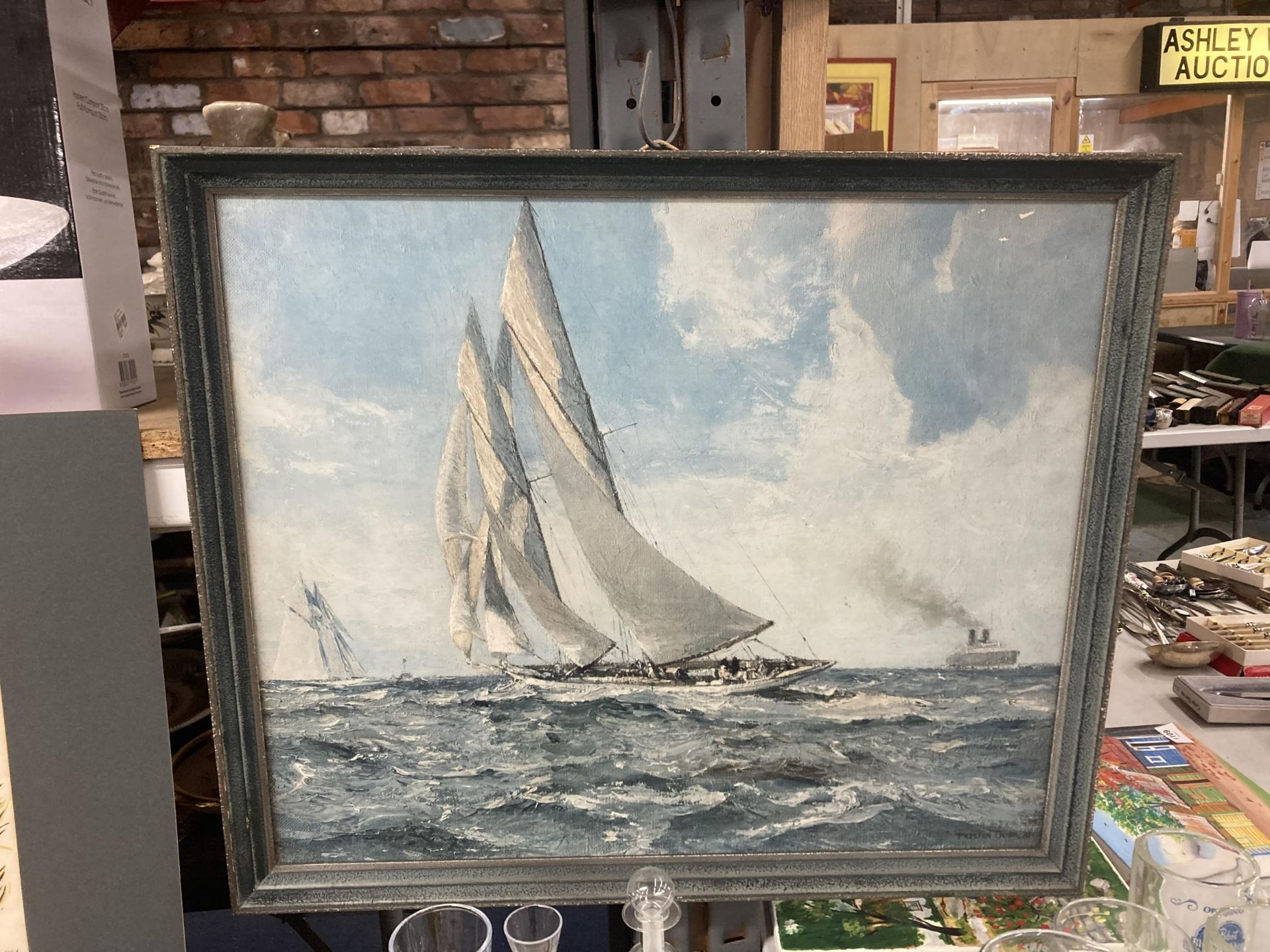 A PRINT OF AN OIL ON CANVAS YACHTING SCENE ON STORMY WATERS
