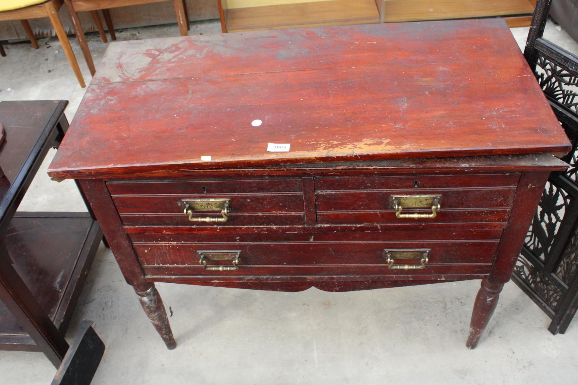 A LATE VICTORIAN CHEST OF TWO SHORT AND ONE LONG DRAWER BEARING MEYNELL (NORTHAMPTON) CABINET MAKERS