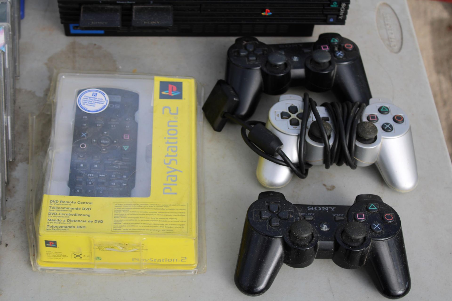A PLAYSTATION 2, AN ASSORTMENT OF PLAYSTATION AND PS2 GAMES AND THREE PS2 CONTROLLERS ETC - Image 2 of 5